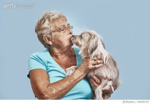 690356767 | 게티이미지코리아 | Elderly women giving her pet dog a kiss Royalty-Free 이미지
