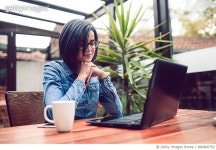 846466750 | 게티이미지코리아 | Young Female Freelancer on Lap Top Video Conference in a Cafe Royalty-Free 이미지