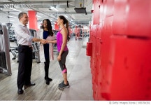 856794392 | 게티이미지코리아 | Woman at the gym handshaking her medical insurance agent Royalty-Free 이미지