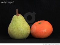 860892806 | 게티이미지코리아 | A Pear and an Orange fruit on black background Royalty-Free 이미지