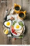 888306682 | 게티이미지코리아 | Heart shape sunny side up served with coffee. Royalty-Free 이미지