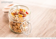 908525048 | 게티이미지코리아 | Homemade muesli with oat flakes, dried fruits and nuts in a jar, selective focus Royalty-Free... 