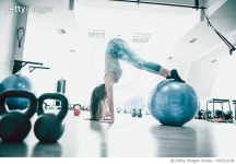 920522196 | 게티이미지코리아 | Athlete Female Doing Balance Pilates Exercise on Fitness Ball in Gym Royalty-Free 이미지