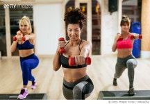 948444954 | 게티이미지코리아 | Women exercising step aerobics with dumbbells at the gym Royalty-Free 이미지