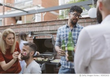 953052632 | 게티이미지코리아 | Friends Watching Soccer Game On Big Screen In Backyard Royalty-Free 이미지