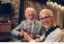 1062999220 | 게티이미지코리아 | Smiling mature couple drinking wine Royalty-Free 이미지
