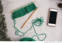 1074164720 | 게티이미지코리아 | A pair of knitting needles, knitting and cell phone Royalty-Free 이미지