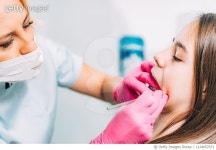 1124657071 | 게티이미지코리아 | Dentist Cleaning Girl Braces In Office Royalty-Free 이미지