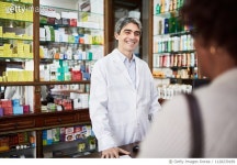 1128239189 | 게티이미지코리아 | Chemist attending a customer at drugstore Royalty-Free 이미지