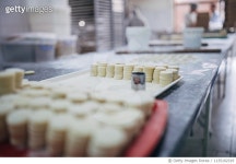 1135102319 | 게티이미지코리아 | Cookies ready to be baked on table in bakery Royalty-Free 이미지