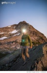 1155882028 | 게티이미지코리아 | Mountaineer on the move, wearing headlamp at dusk in the mountains. Royalty-Free 이미지