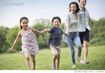 ㈜마국로지스 | 1167588323 | 게티이미지코리아 | Happy young Chinese family running on grass Royalty-Free 이미지