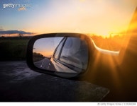 1191963284 | 게티이미지코리아 | View of a car wing mirror. Sunset time Royalty-Free 이미지