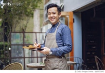 1199754045 | 게티이미지코리아 | Asian coffee shop owner standing in front of the shop Royalty-Free 이미지