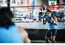 1149328348 | 게티이미지코리아 | Male boxer shadow boxing in mirror in boxing gym Royalty-Free 이미지