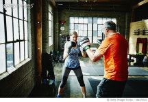 684979543 | 게티이미지코리아 | Mature woman boxing with workout partner in gym Royalty-Free 이미지