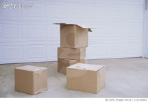 1210306484 | 게티이미지코리아 | Cardboard boxes next to the garage door Royalty-Free 이미지