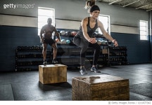 1211977342 | 게티이미지코리아 | Woman doing box jumps at cross training gym Royalty-Free 이미지
