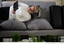 1210053295 | 게티이미지코리아 | Young woman with tablet pc on the sofa Royalty-Free 이미지
