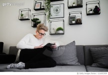 1210053509 | 게티이미지코리아 | Young woman with tablet pc on the sofa Royalty-Free 이미지