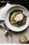 1226027023 | 게티이미지코리아 | Healthy salad and poached egg breakfast at wellness cafe Royalty-Free 이미지