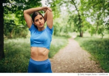 1244901140 | 게티이미지코리아 | One fit young woman warming up before jogging in park Royalty-Free 이미지