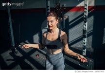 1253278829 | 게티이미지코리아 | One fit woman jumping on a skipping rope in the gym Royalty-Free 이미지