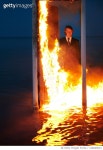 1266483201 | 게티이미지코리아 | Man standing behind the burning door in the sea. Nicely fit for book cover Royalty-Free 이미지