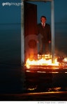 1266483213 | 게티이미지코리아 | Man standing behind the burning door in the sea. Nicely fit for book cover Royalty-Free 이미지