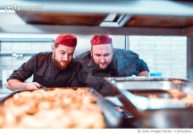 1266929014 | 게티이미지코리아 | Male Bakers Waiting For Fresh Bread To Be Baked Royalty-Free 이미지