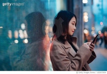 1282633604 | 게티이미지코리아 | Connect the future - young woman using mobile phone on street Royalty-Free 이미지