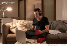 1326098264 | 게티이미지코리아 | Male musician reading notes during online lesson Royalty-Free 이미지