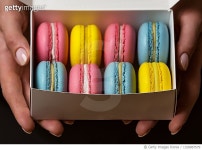 1328867579 | 게티이미지코리아 | Cropped hands holding colorful macaroons in box Royalty-Free 이미지