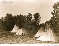 UIG680252 | 게티이미지코리아 | An Assiniboine camp containing four tepees with Indians seated on ground Rights-Managed 이미지
