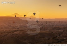 1370641233 | 게티이미지코리아 | Hot air balloons at sunrise over the beautiful landscape in Cappadocia, Turkey Royalty-Free... 