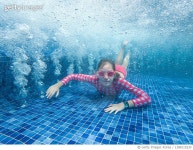 1388115230 | 게티이미지코리아 | Cheerful young girl swimming at SPA. Cancun Mexico Royalty-Free 이미지