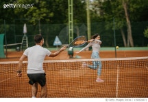 1396824671 | 게티이미지코리아 | Young people playing tennis outdoors Royalty-Free 이미지