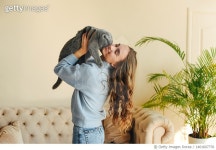 1401607776 | 게티이미지코리아 | Young beautiful girl with a pet cat. British fold stubborn gray cat. Royalty-Free 이미지