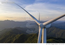 1417343700 | 게티이미지코리아 | Aerial shot of a wind turbine on a mountain Royalty-Free 이미지