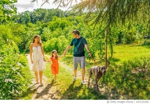 1451151494 | 게티이미지코리아 | Happy family having fun with their dog at the backyard. Royalty-Free 이미지