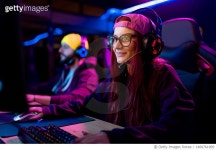 1460761909 | 게티이미지코리아 | Happy female gamer playing eSports on desktop PC in gaming club. Royalty-Free 이미지