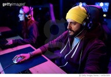 1465815850 | 게티이미지코리아 | Male hipster playing eSports on PC in gaming club. Royalty-Free 이미지