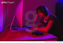 1474903970 | 게티이미지코리아 | Teenage Boy Playing Multiplayer Games on Desktop pc in his Dark Room with red light Royalty-Free... 