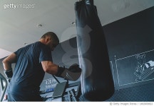 1482809822 | 게티이미지코리아 | Boxing training, punching bag at fitness gym, health club Royalty-Free 이미지