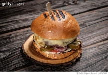 1498515012 | 게티이미지코리아 | Close-up of burger on wooden table,Russia Royalty-Free 이미지