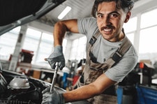 Mechanic Examining Car in Auto Car Repair Service Center Stock Image - Image of station, people: 277647343