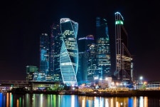 The City Of Moscow At Night, View From The Embankment Of The Moscow River To The Business District. Architecture And Landmark Of... 