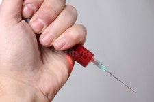 Syringes in hand two stock image. Image of pharmacology - 184606385