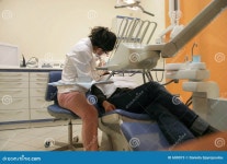 Dentist with patient stock image. Image of examination - 600073