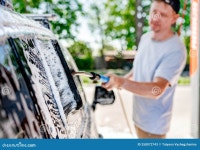 A Man Washing a Car at a Self-service Car Wash Stock Image - Image of people, city: 258072743